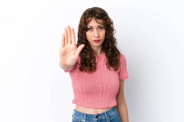 Young Woman Curly Hair Isolated White Background Making Stop Gesture — Φωτογραφία Αρχείου