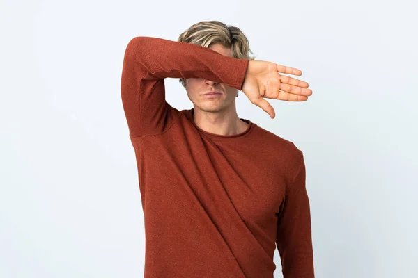 English man over isolated white background covering eyes by hands