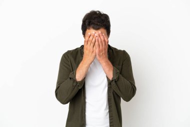 Caucasian handsome man over isolated white background with tired and sick expression