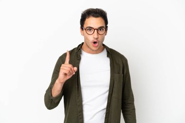 Caucasian handsome man over isolated white background intending to realizes the solution while lifting a finger up