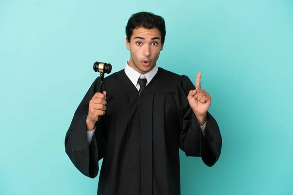 Judge Isolated Blue Background Intending Realizes Solution While Lifting Finger — Stock Photo, Image