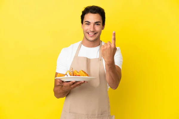 Restaurant Waiter Holding Waffles Isolated Yellow Background Doing Coming Gesture — Photo