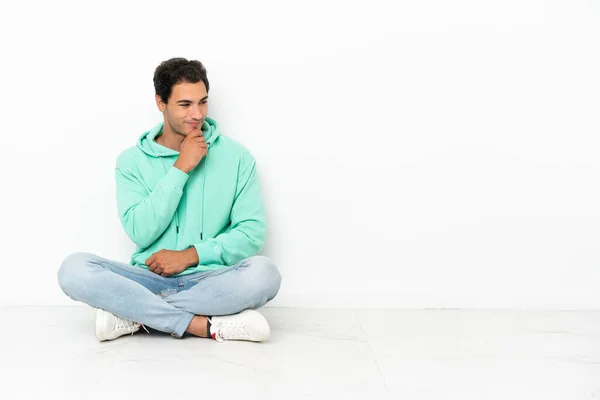 Caucasian Handsome Man Sitting Floor Looking Side — Stock Fotó