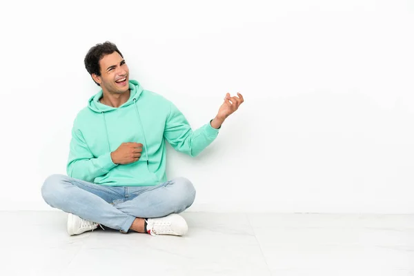 Caucasian Handsome Man Sitting Floor Making Guitar Gesture — Stok fotoğraf