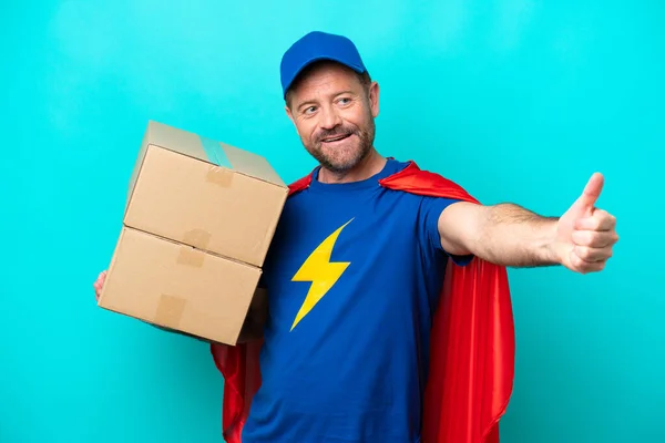 Super Hero Delivery Man Isolated Blue Background Giving Thumbs Gesture — 스톡 사진