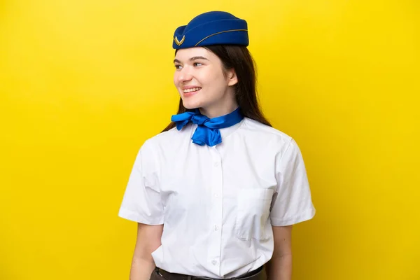 Airplane Stewardess Russian Woman Isolated Yellow Background Looking Side —  Fotos de Stock