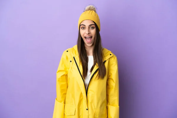 Young Caucasian Woman Wearing Rainproof Coat Isolated Purple Background Surprise — Fotografia de Stock