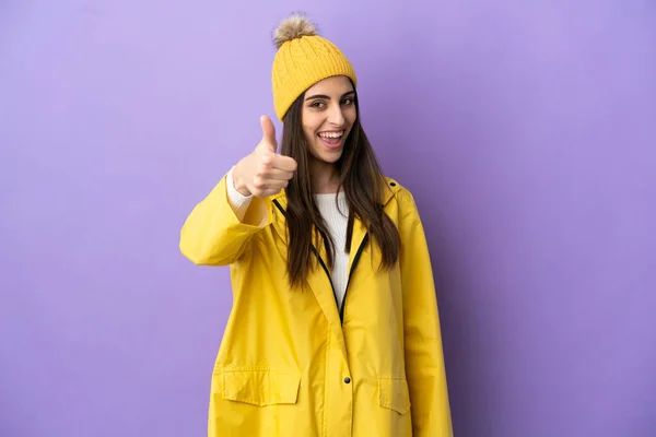 Young Caucasian Woman Wearing Rainproof Coat Isolated Purple Background Thumbs — Φωτογραφία Αρχείου