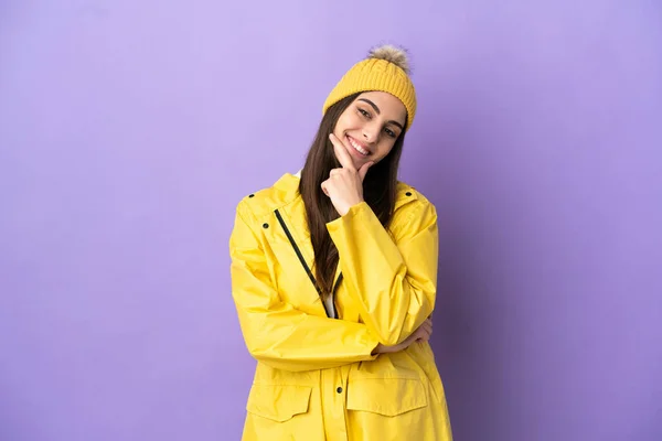 Young Caucasian Woman Wearing Rainproof Coat Isolated Purple Background Happy —  Fotos de Stock