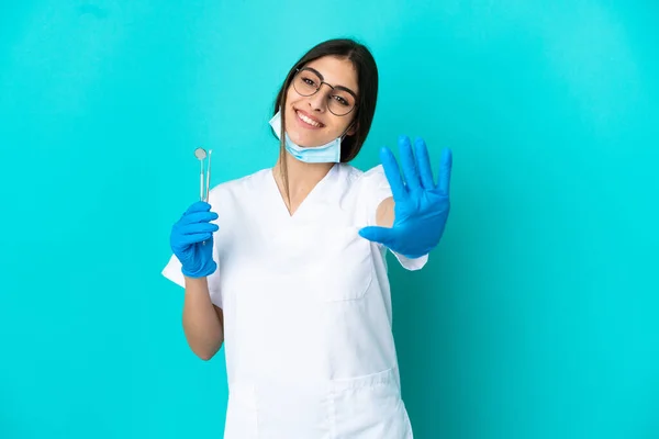 Young Caucasian Dentist Woman Holding Tools Isolated Blue Background Counting — Stockfoto
