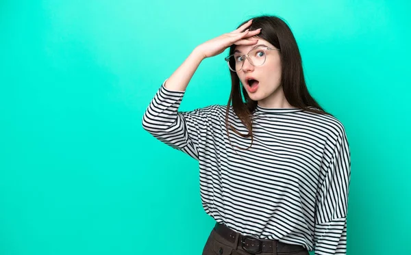 Young Russian Woman Isolated Green Background Doing Surprise Gesture While — 스톡 사진