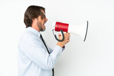 Senior dutch business man isolated on white background shouting through a megaphone