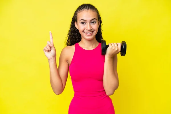 Young Sport Woman Making Weightlifting Isolated Yellow Background Pointing Great — Stock fotografie