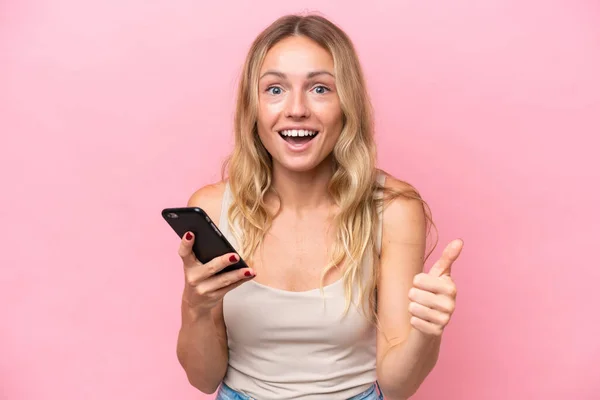 Young Russian Woman Isolated Pink Background Using Mobile Phone While — Stok fotoğraf