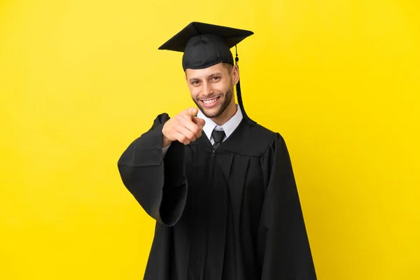 Young University Graduate Caucasian Man Isolated Yellow Background Points Finger — Φωτογραφία Αρχείου
