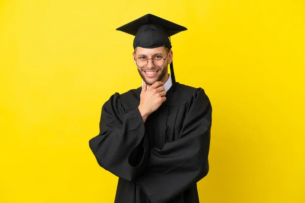 Young University Graduate Caucasian Man Isolated Yellow Background Glasses Smiling — Fotografia de Stock