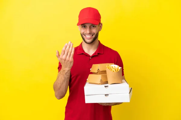 Pizza Delivery Man Picking Pizza Boxes Burgers Isolated Background Inviting — Φωτογραφία Αρχείου