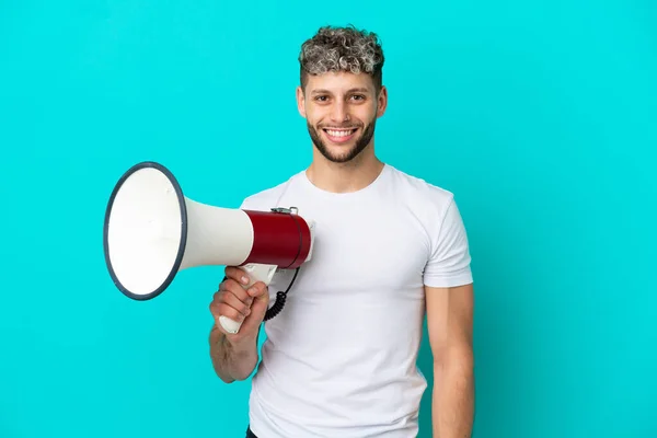 Young Handsome Caucasian Man Isolated Blue Background Holding Megaphone Smiling — 스톡 사진