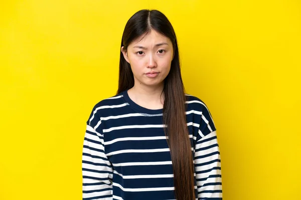 Young Chinese Woman Isolated Yellow Background Sad Expression — Foto Stock