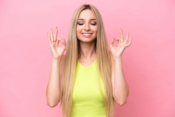 Pretty Blonde Woman Isolated Pink Background Zen Pose — стоковое фото