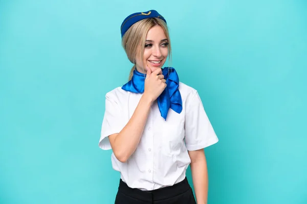 Airplane Blonde Stewardess Woman Isolated Blue Background Looking Side — Zdjęcie stockowe