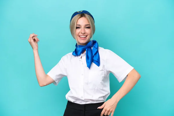 Airplane Blonde Stewardess Woman Isolated Blue Background Making Guitar Gesture — Stock Photo, Image