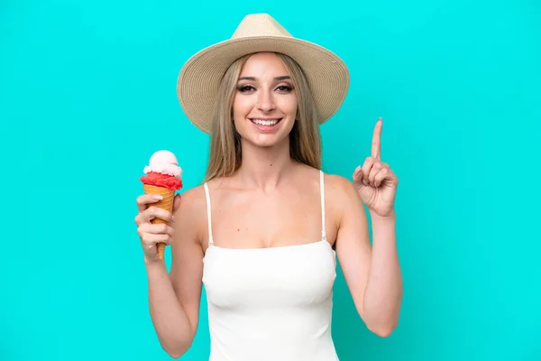 Blonde Woman Swimsuit Holding Ice Cream Isolated Blue Background Pointing — ストック写真