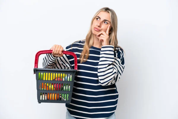Young Caucasian Woman Holding Shopping Basket Full Food Isolated White — 스톡 사진
