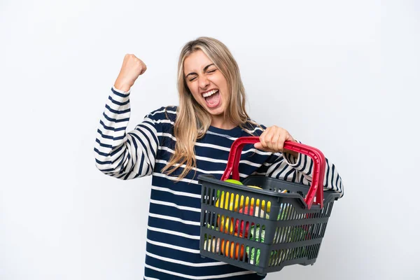 Young Caucasian Woman Holding Shopping Basket Full Food Isolated White — Stock Photo, Image