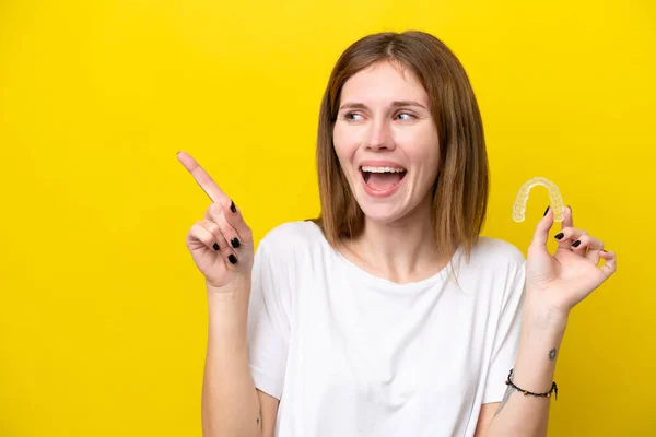 Young English Woman Holding Invisible Braces Intending Realizes Solution While —  Fotos de Stock