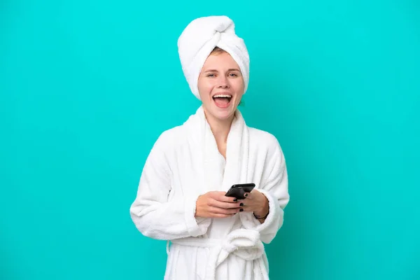 Young Woman Bathrobe Isolated Blue Background Surprised Sending Message — 图库照片