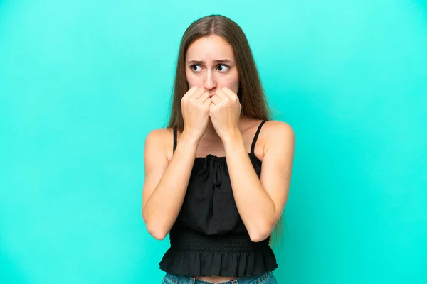 Young Caucasian Woman Isolated Blue Background Nervous Scared Putting Hands — Stock Photo, Image