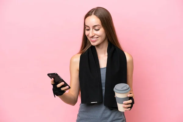 Young Sport Caucasian Woman Wearing Towel Isolated Pink Background Holding — Stock Photo, Image