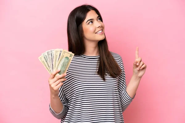 Young Brazilian Woman Taking Lot Money Isolated Pink Background Pointing — Stock fotografie