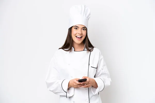 Young Brazilian Chef Woman Isolated White Background Surprised Sending Message — стоковое фото