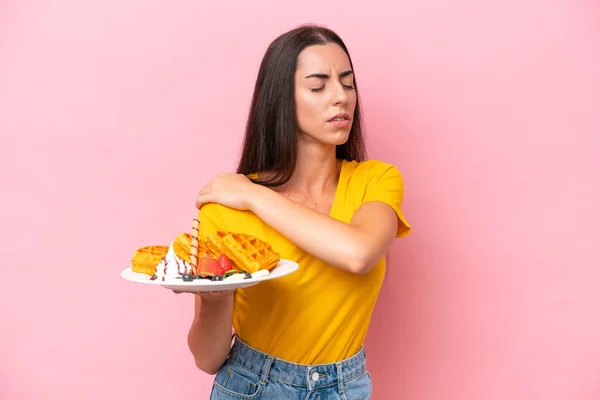 Young Caucasian Woman Holding Waffles Isolated Pink Background Suffering Pain — Stock Fotó