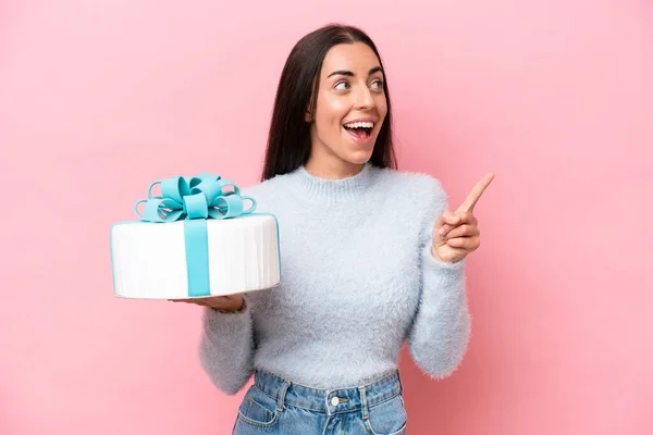 Young Caucasian Woman Holding Birthday Cake Isolated Pink Background Intending — 스톡 사진