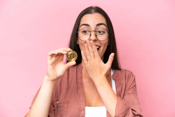 Young Caucasian Woman Holding Bitcoin Isolated Pink Background Surprise Shocked — стокове фото