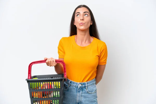 Young Caucasian Woman Holding Shopping Basket Full Food Isolated White — 图库照片