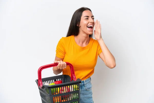 Young Caucasian Woman Holding Shopping Basket Full Food Isolated White — 图库照片