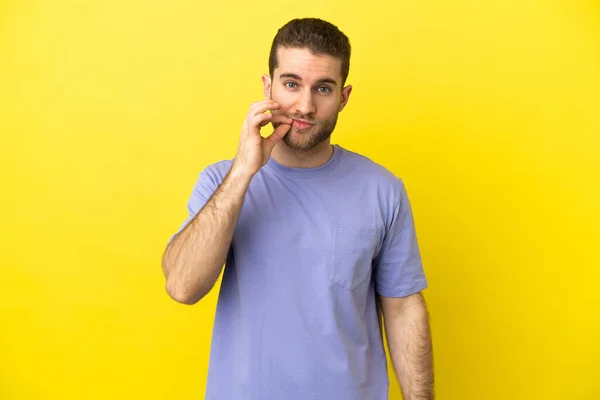 Handsome Blonde Man Isolated Yellow Background Showing Sign Silence Gesture — ストック写真