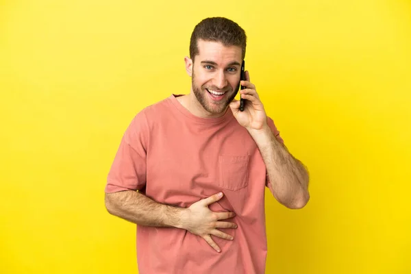 Handsome Blonde Man Using Mobile Phone Isolated Background Smiling Lot — Stockfoto