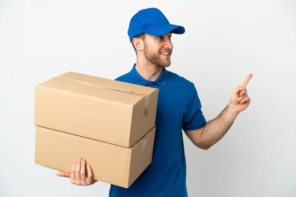 Delivery man over isolated white background pointing up a great idea