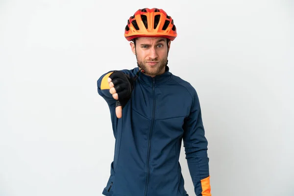 Young Cyclist Man Isolated White Background Showing Thumb Negative Expression —  Fotos de Stock