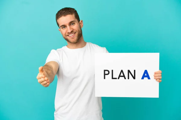 Handsome Blonde Man Isolated Blue Background Holding Placard Message Plan — Photo