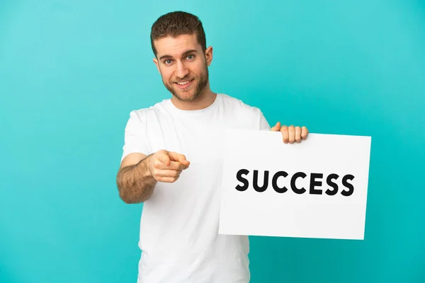Handsome Blonde Man Isolated Blue Background Holding Placard Text Success —  Fotos de Stock
