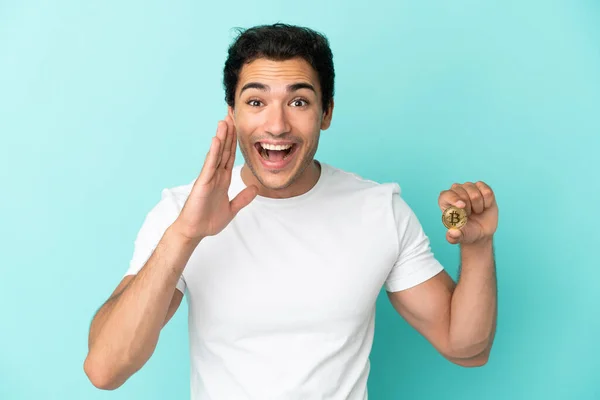 Young Man Holding Bitcoin Isolated Blue Background Shouting Mouth Wide — 스톡 사진