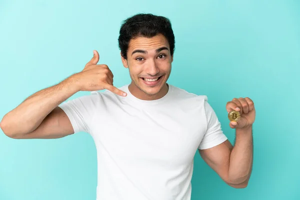 Young Man Holding Bitcoin Isolated Blue Background Making Phone Gesture — Stockfoto