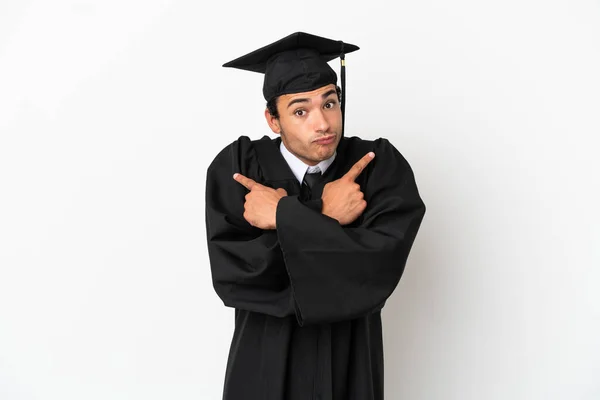 Young University Graduate Isolated White Background Pointing Laterals Having Doubts — Stock Fotó