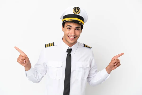 Airplane Pilot Isolated White Background Pointing Finger Laterals Happy — Zdjęcie stockowe